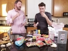Video of two dudes making and eating food in the kitchen. HD